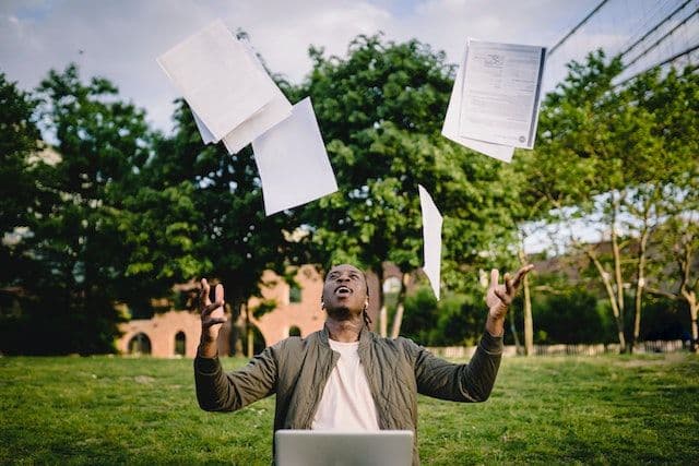 young person writing a Student CV 